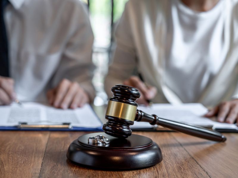 Divorce attorney in Raleigh NC with legal documents and gavel symbolizing no-fault divorce process and legal support